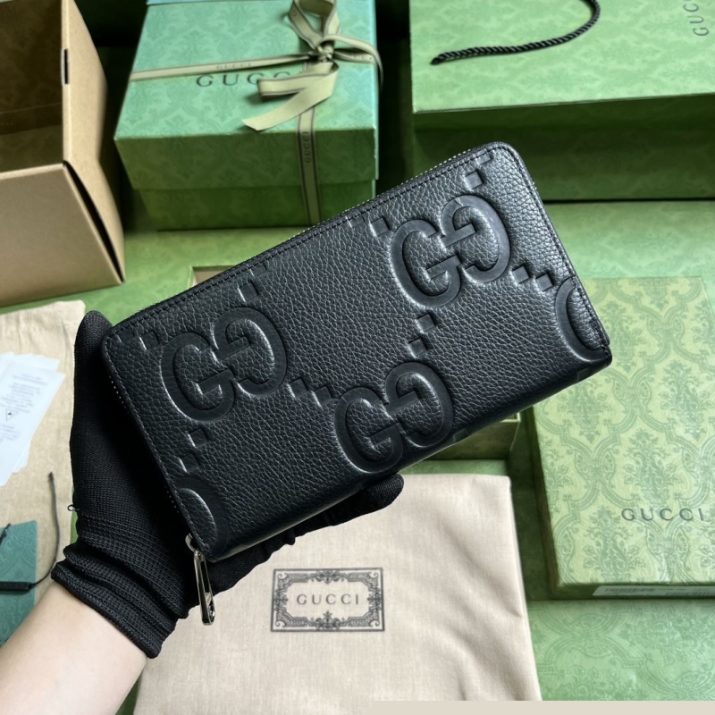 G*u*i clutch bags